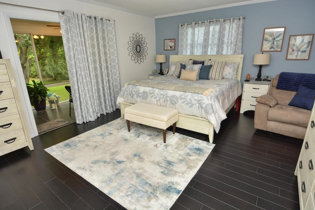 bedroom with crown molding and dark wood-style floors