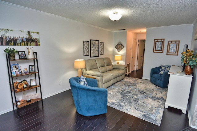 living room with baseboards, ornamental molding, a textured ceiling, and wood finished floors