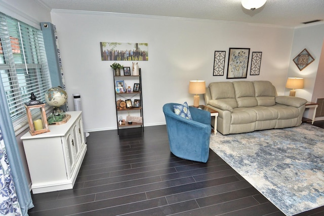 living area with a textured ceiling, visible vents, dark wood-style flooring, baseboards, and ornamental molding