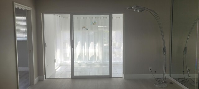 interior space featuring baseboards and a wealth of natural light