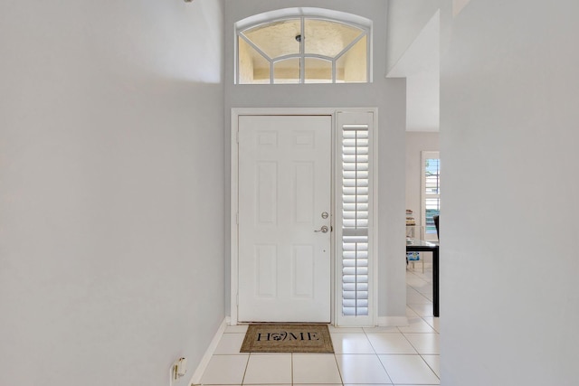 7026 Galleon Cv, Riviera Beach, FL 33418 - foyer entrance featuring light tile patterned flooring and baseboards