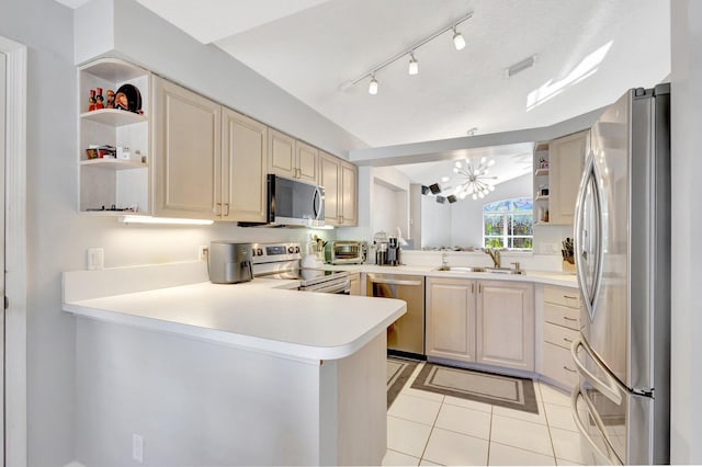7026 Galleon Cv, Riviera Beach, FL 33418 - kitchen featuring appliances with stainless steel finishes, open shelves, a sink, a peninsula, and a chandelier