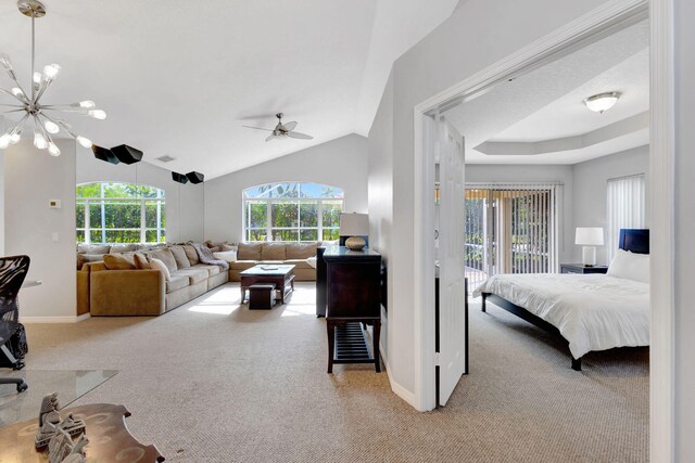 7026 Galleon Cv, Riviera Beach, FL 33418 - bedroom featuring carpet floors, multiple windows, access to exterior, and vaulted ceiling
