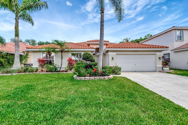 mediterranean / spanish home featuring driveway, an attached garage, stucco siding, a tile roof, and a front lawn
