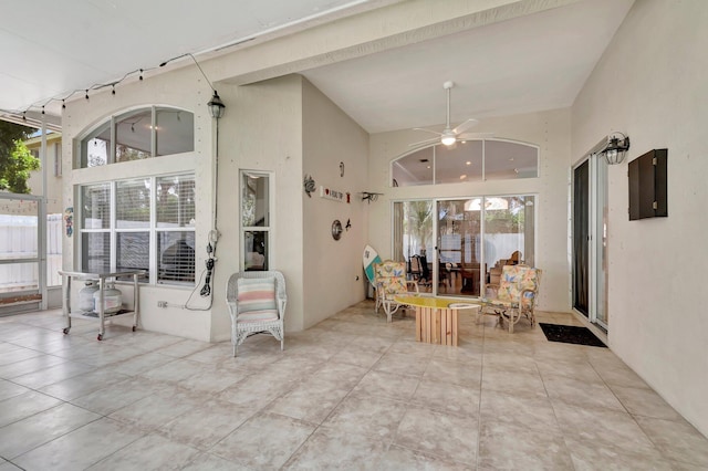 interior space with a towering ceiling and tile patterned floors