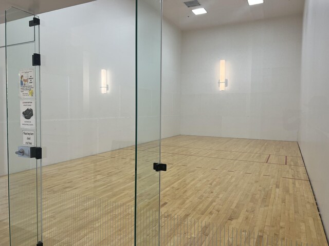 view of community with a sport court