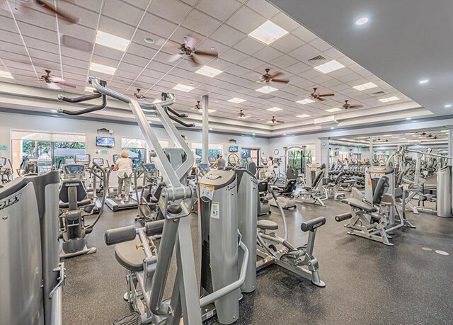 exercise room with visible vents and a drop ceiling