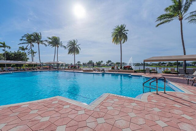 community pool with a patio area