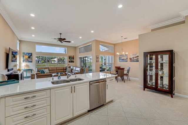 kitchen featuring a sink, dishwasher, ornamental molding, recessed lighting, and baseboards