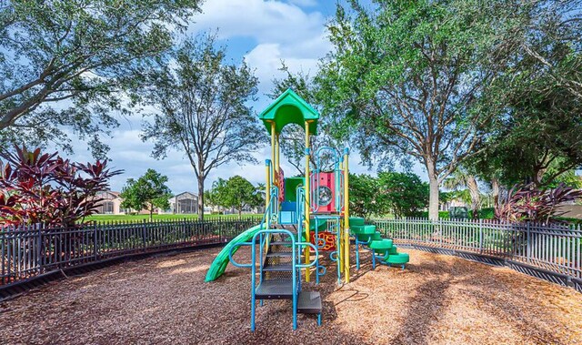 communal playground featuring fence