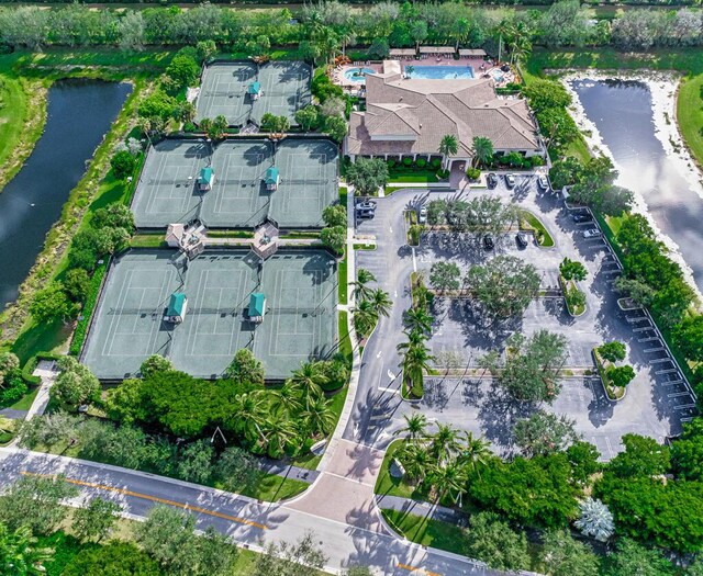 aerial view of property and surrounding area featuring a nearby body of water