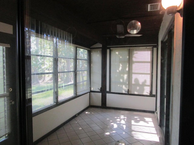 unfurnished sunroom with visible vents
