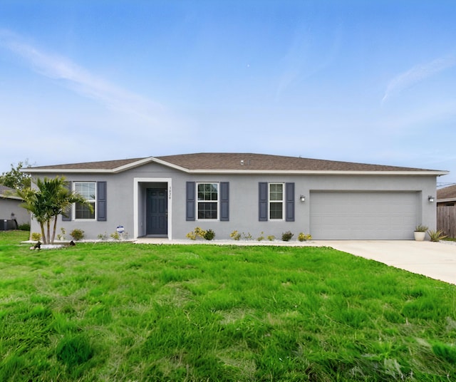 3020 SW Ann Arbor Rd, Port Saint Lucie, FL 34953 - ranch-style home with stucco siding, a garage, concrete driveway, and a front lawn