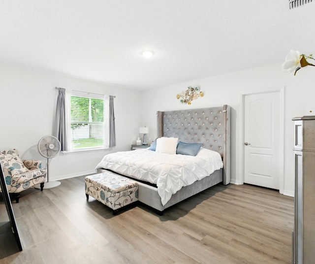 3020 SW Ann Arbor Rd, Port Saint Lucie, FL 34953 - bedroom with light wood-style floors and baseboards