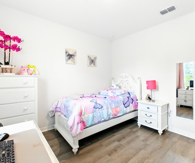 3020 SW Ann Arbor Rd, Port Saint Lucie, FL 34953 - bedroom with wood finished floors and baseboards