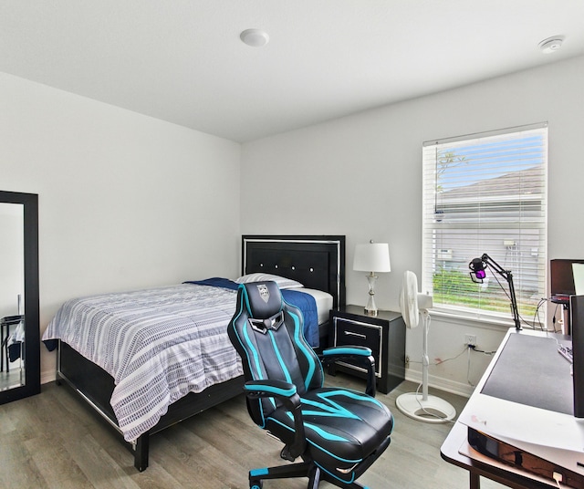 3020 SW Ann Arbor Rd, Port Saint Lucie, FL 34953 - bedroom with wood finished floors and baseboards