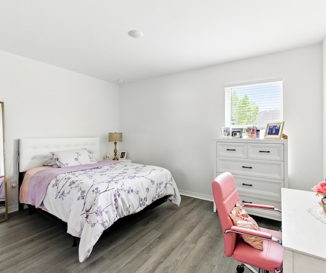3020 SW Ann Arbor Rd, Port Saint Lucie, FL 34953 - bedroom with wood finished floors and baseboards
