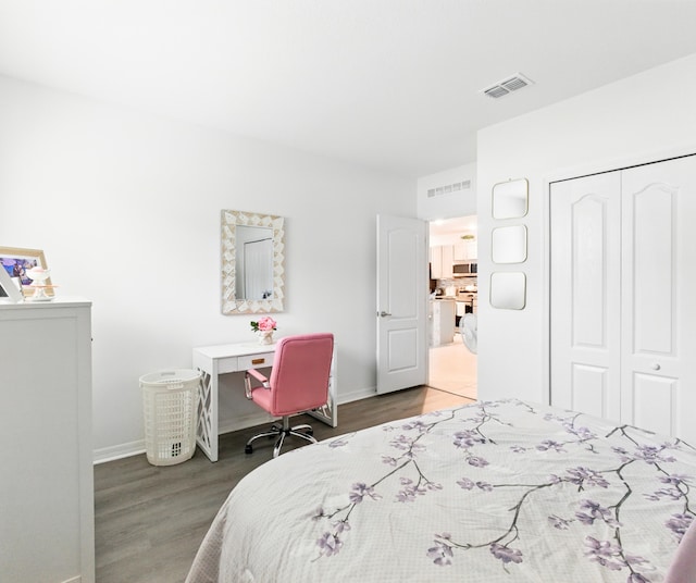 3020 SW Ann Arbor Rd, Port Saint Lucie, FL 34953 - bedroom with wood finished floors, baseboards, and a closet