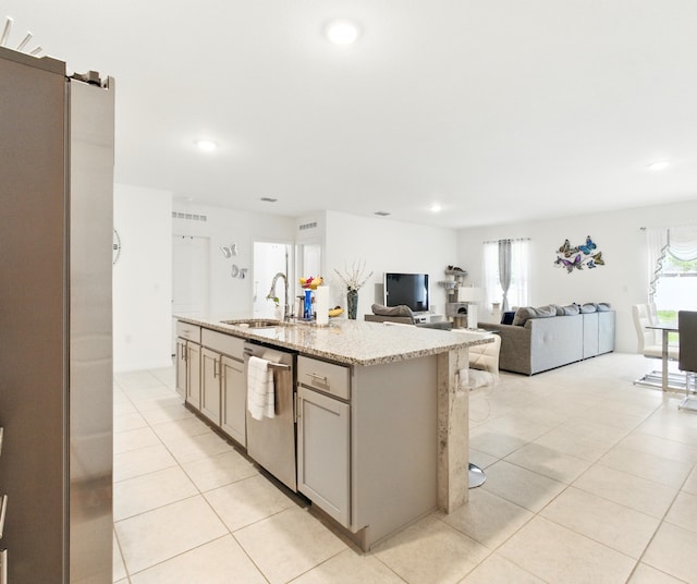 3020 SW Ann Arbor Rd, Port Saint Lucie, FL 34953 - kitchen featuring stainless steel appliances, a sink, gray cabinets, light tile patterned flooring, and recessed lighting