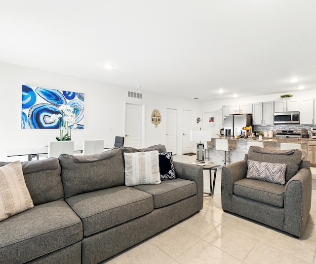 3020 SW Ann Arbor Rd, Port Saint Lucie, FL 34953 - living room featuring light tile patterned floors and recessed lighting