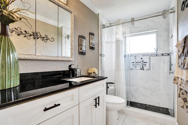 full bath featuring toilet, a marble finish shower, marble finish floor, and vanity
