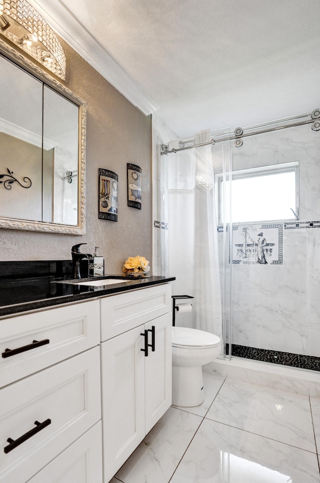 bathroom featuring toilet, marble finish floor, a shower stall, vanity, and a textured wall