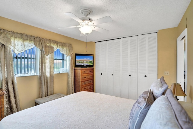 bedroom with ceiling fan, a textured ceiling, and a closet