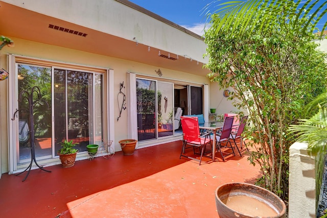 view of patio / terrace featuring outdoor dining space and visible vents