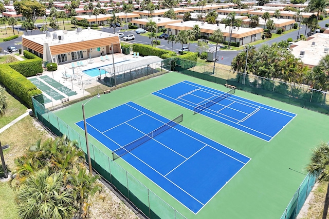 view of sport court with fence