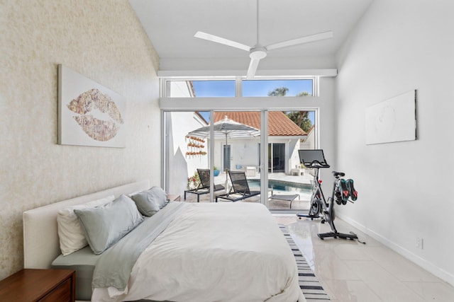 bedroom with baseboards, wallpapered walls, and access to exterior
