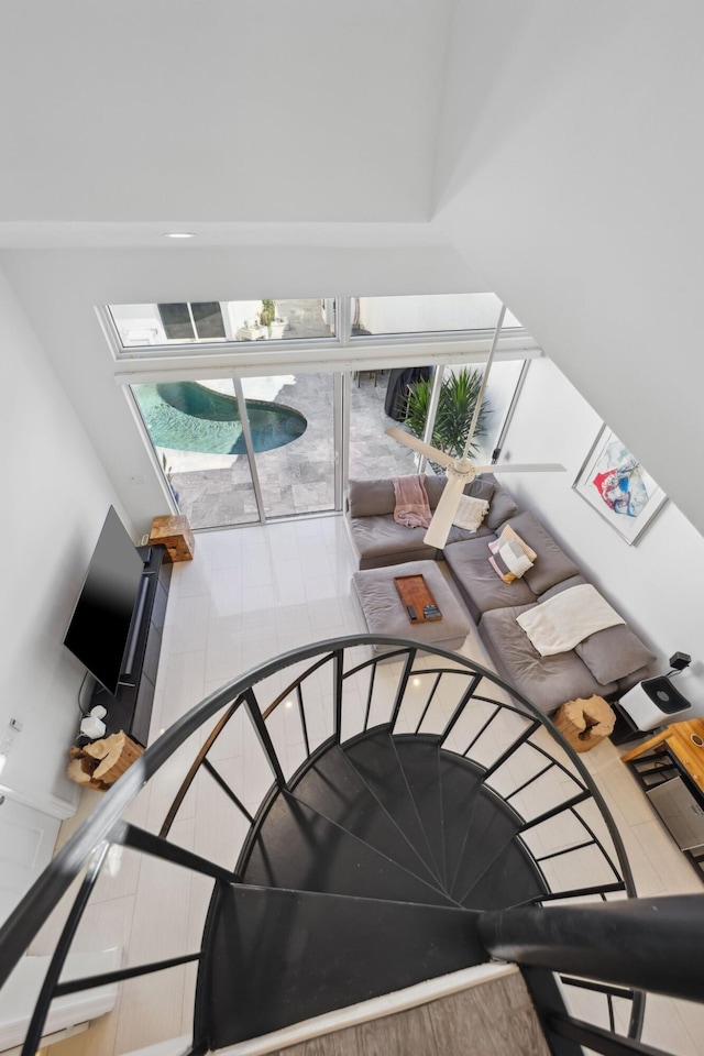 stairway with tile patterned flooring and plenty of natural light