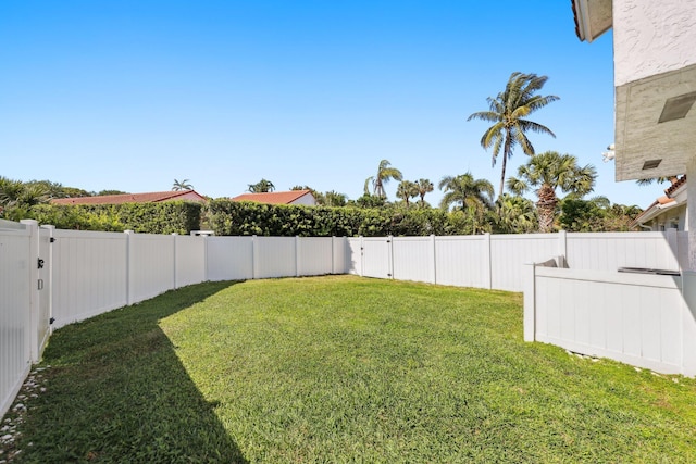view of yard with a fenced backyard
