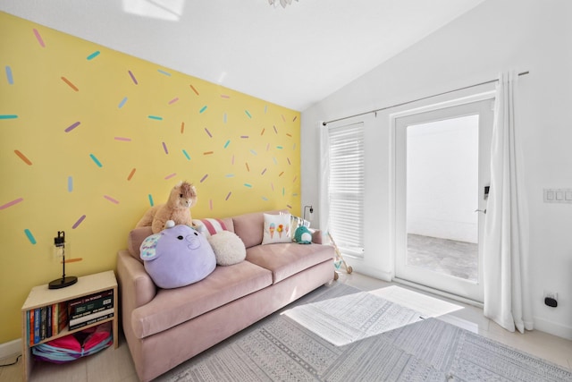 living area featuring lofted ceiling