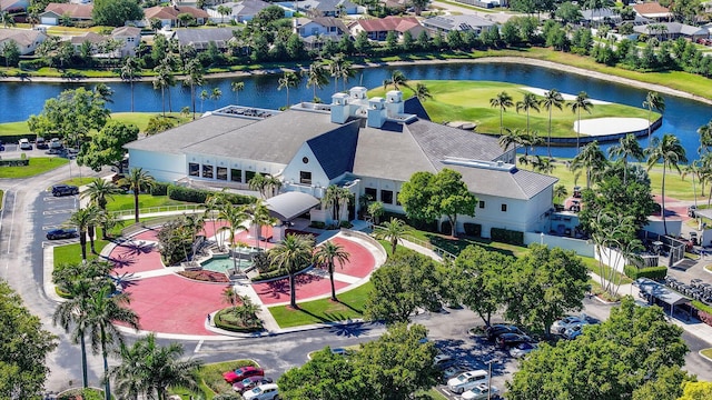 birds eye view of property featuring a water view and a residential view