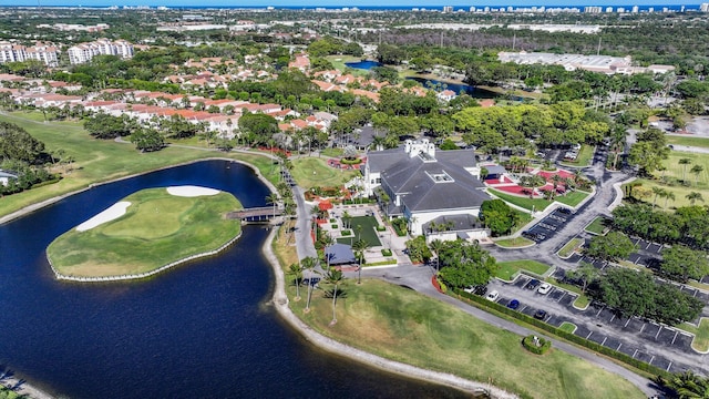 drone / aerial view featuring a water view and view of golf course