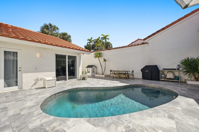 pool with a patio