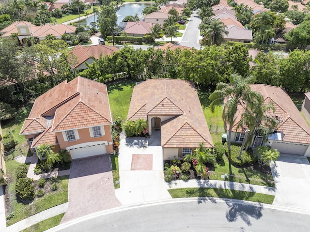 aerial perspective of suburban area with a large body of water