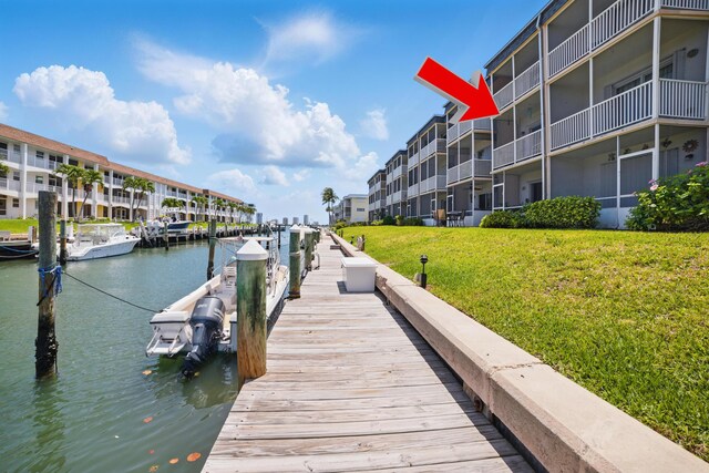 111 Doolen Ct Unit 208, North Palm Beach, FL 33408 - dock with a lawn and a water view