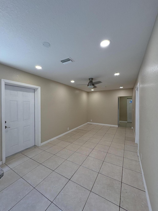 unfurnished room featuring baseboards, recessed lighting, ceiling fan, and light tile patterned flooring