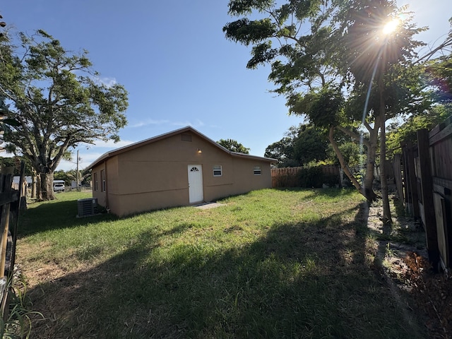 view of yard featuring central air condition unit and fence private yard
