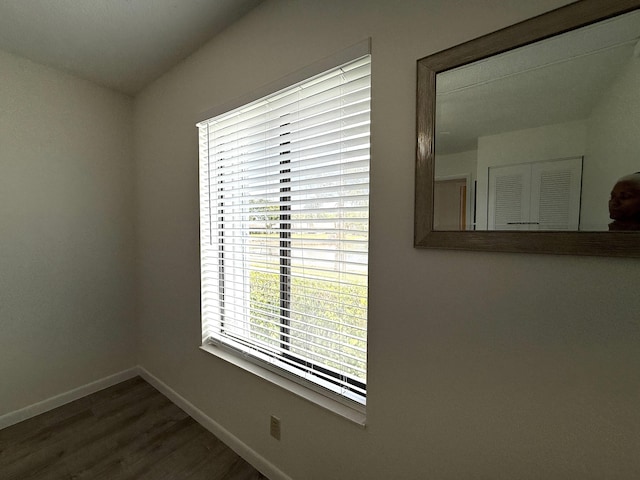 detailed view of baseboards and wood finished floors