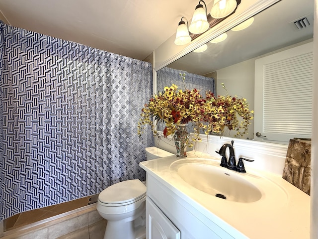 full bathroom with toilet, tiled shower, vanity, and tile patterned floors