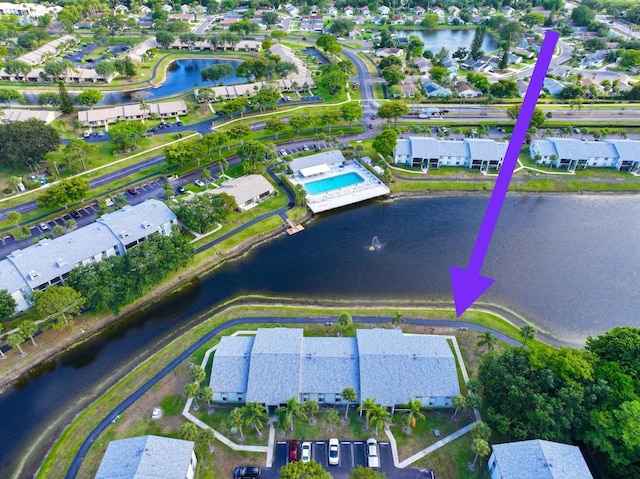 aerial perspective of suburban area with a large body of water
