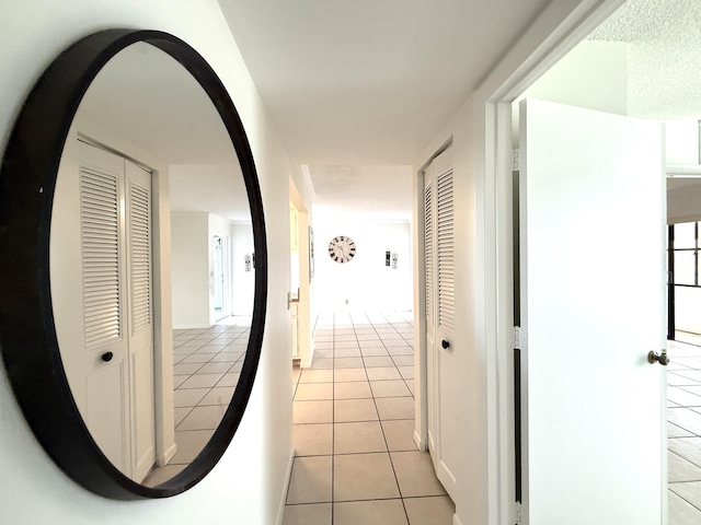 corridor with light tile patterned floors