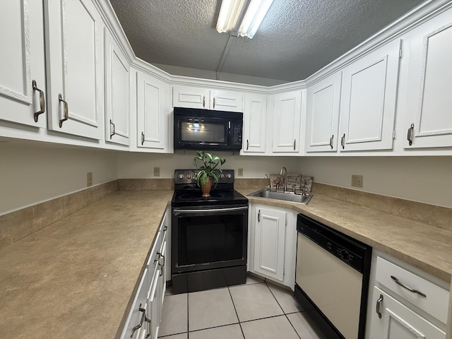 kitchen featuring black appliances, a sink, white cabinets, light tile patterned flooring, and a textured ceiling