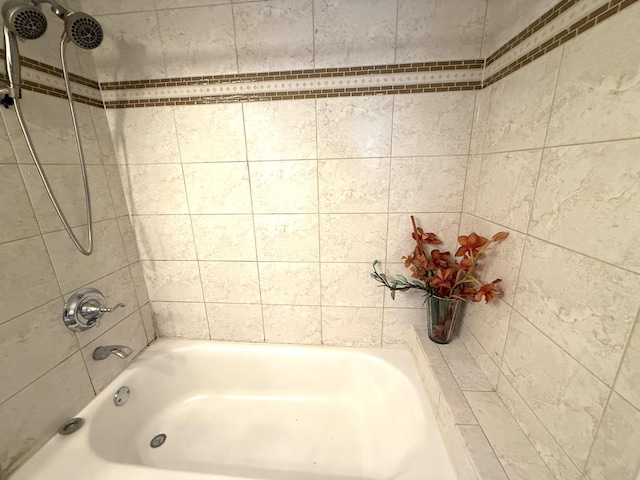 bathroom with shower / washtub combination