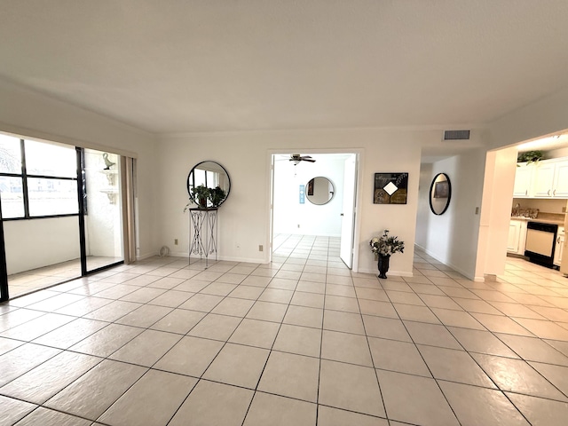 foyer with light tile patterned floors and a ceiling fan