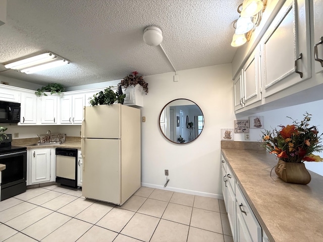 kitchen with black appliances, a sink, baseboards, white cabinets, and a textured ceiling