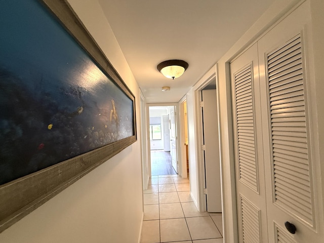 corridor with light tile patterned floors
