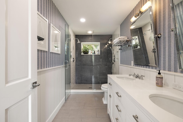 19100 SE County Line Rd, Jupiter, FL 33469 - full bath with a shower stall, double vanity, toilet, tile patterned floors, and wainscoting